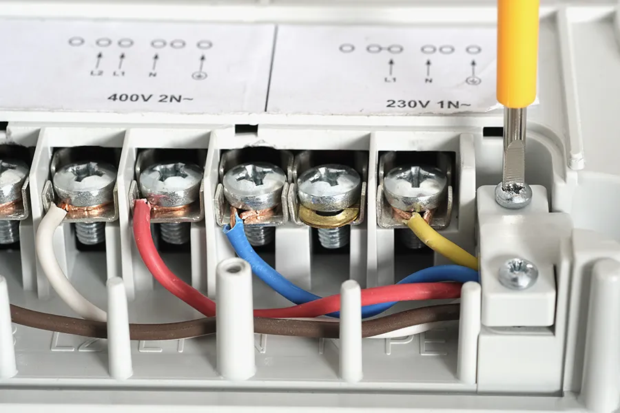 Inside of a electrical consumer unit showing connections of the induction panel cooker and contacts
