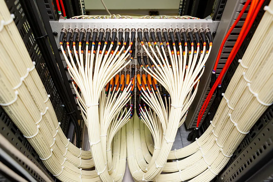 Close up of a network of fiber optic cables.